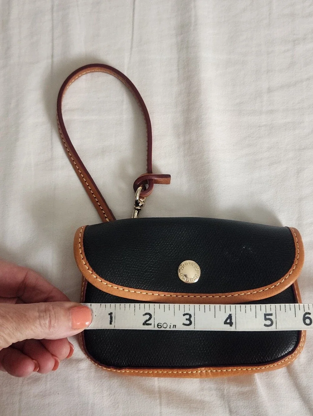 Dooney and Bourke Pebbled Leather Bristol Pouch with Clip Black w Brown Trim